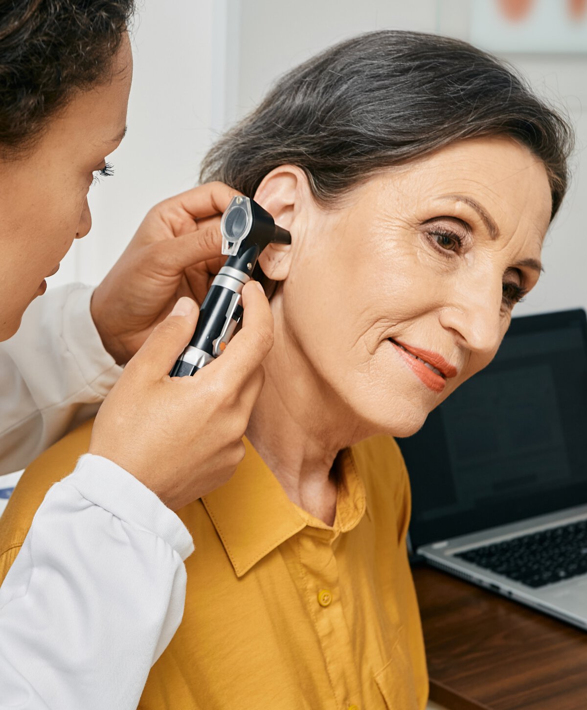 Hollywood doctor doing ear testing on female patient